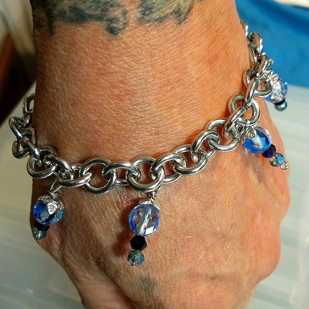 Silver bracelet with magical blue and black crystals